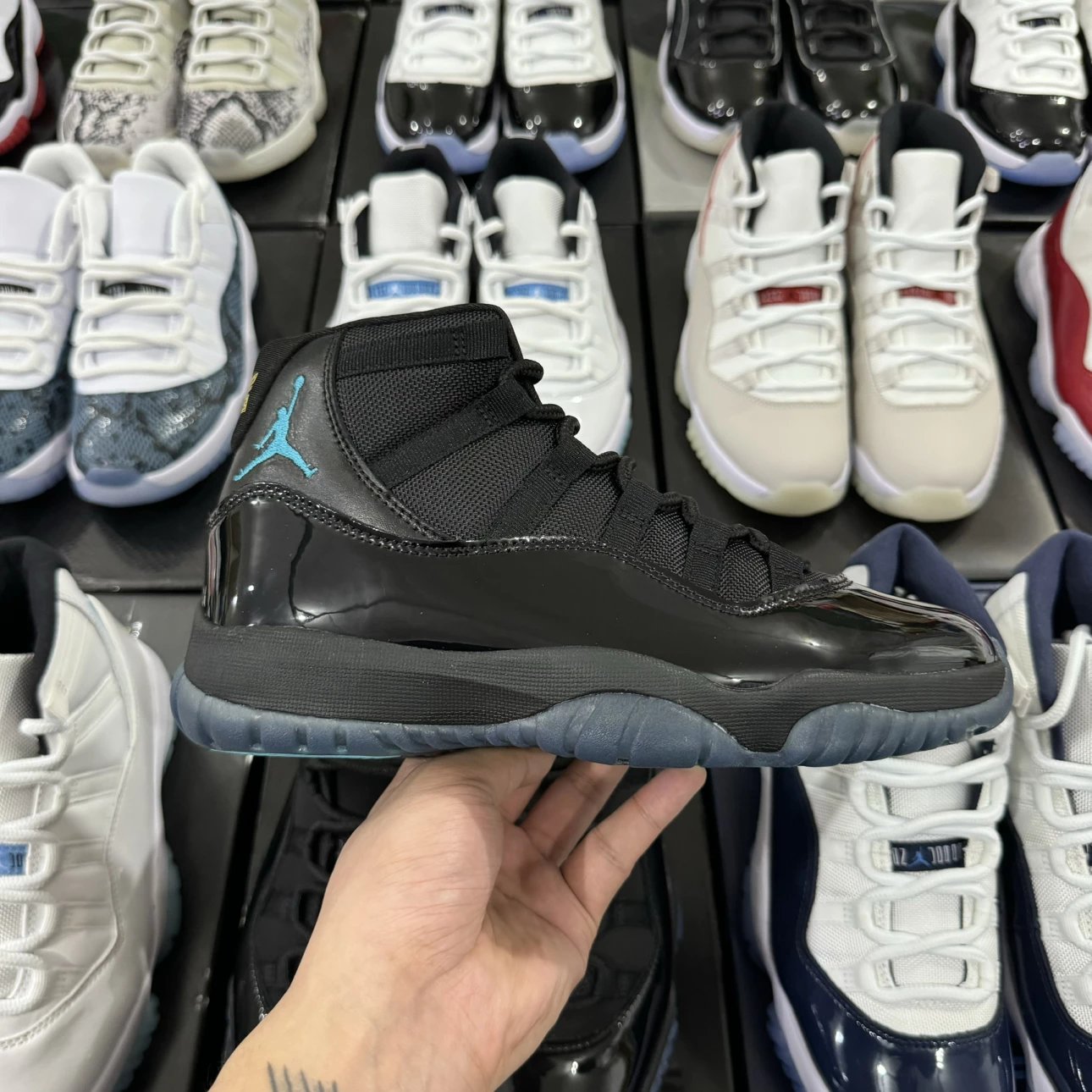 Air Jordan 11 Retro High Black with Sky Blue Logo