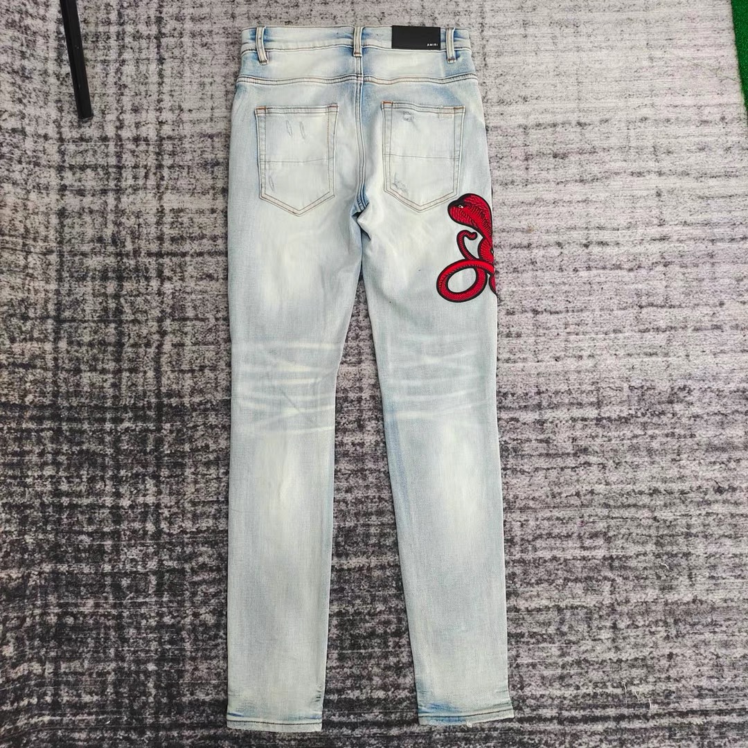 amiri red snake embroidered hole patched jeans