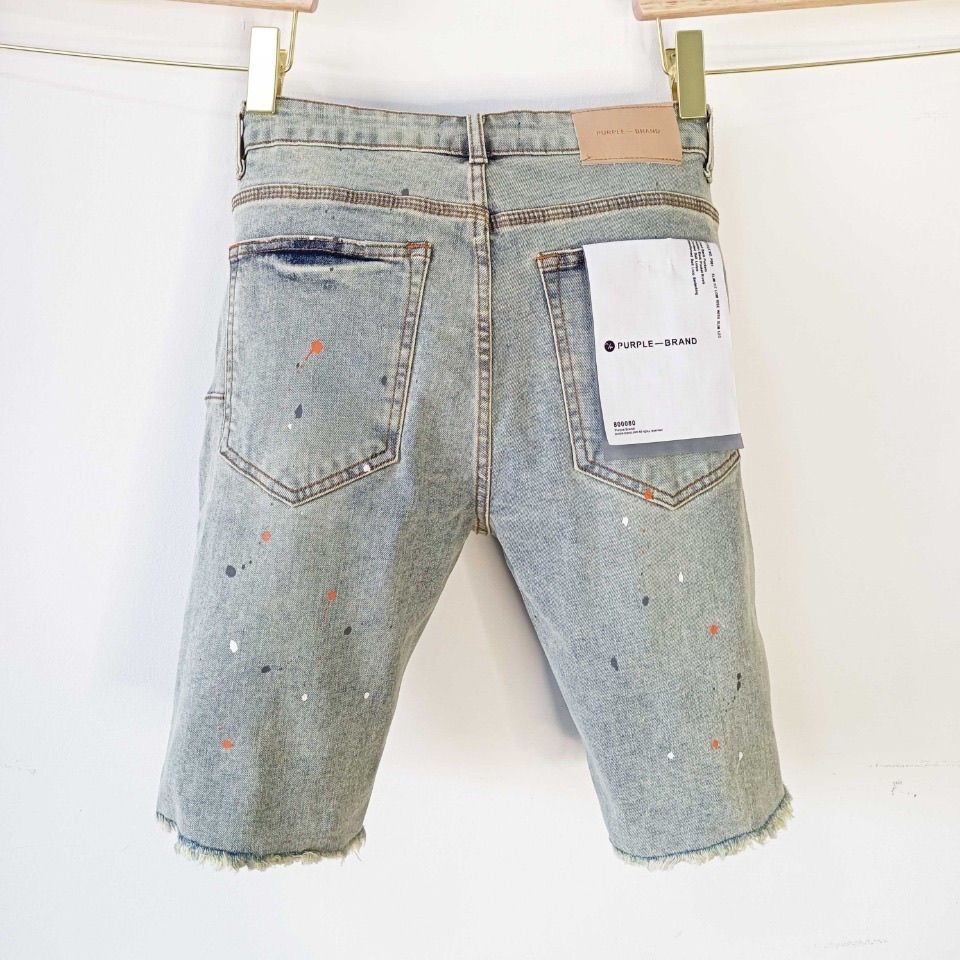 purple spray-painted patch shorts