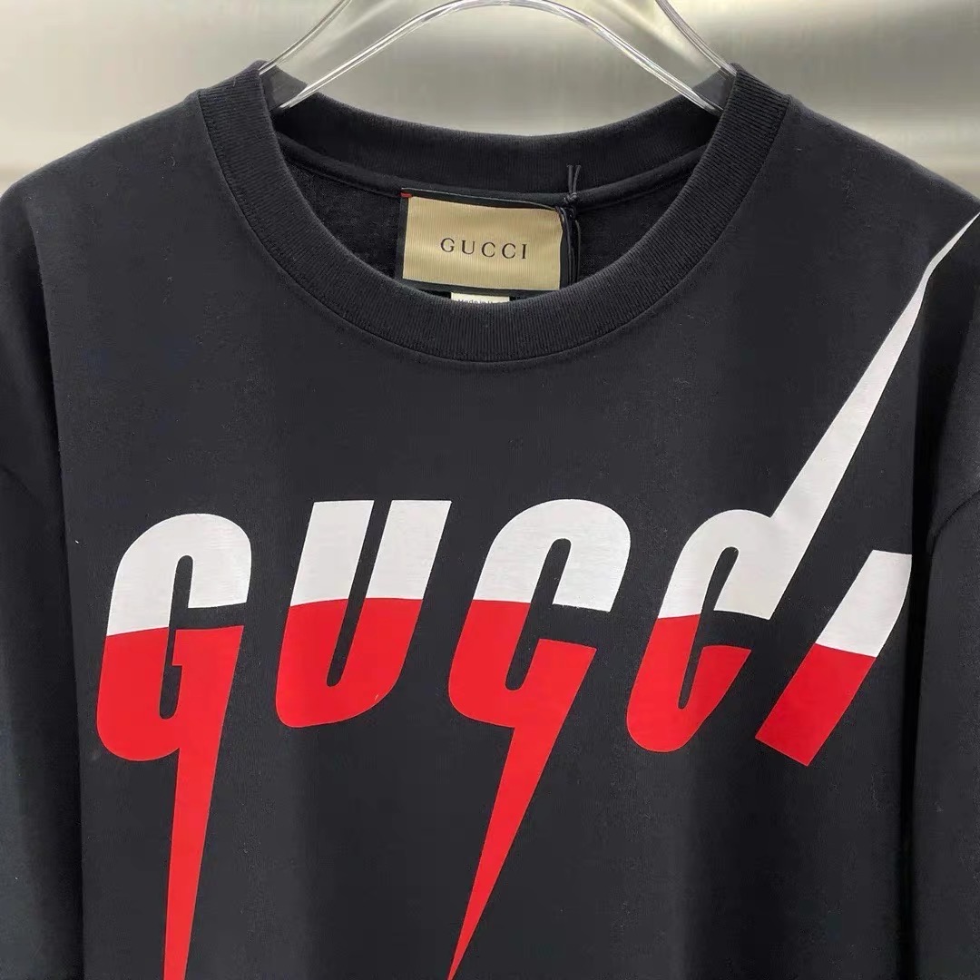 Gucci lighting black and cream color tees