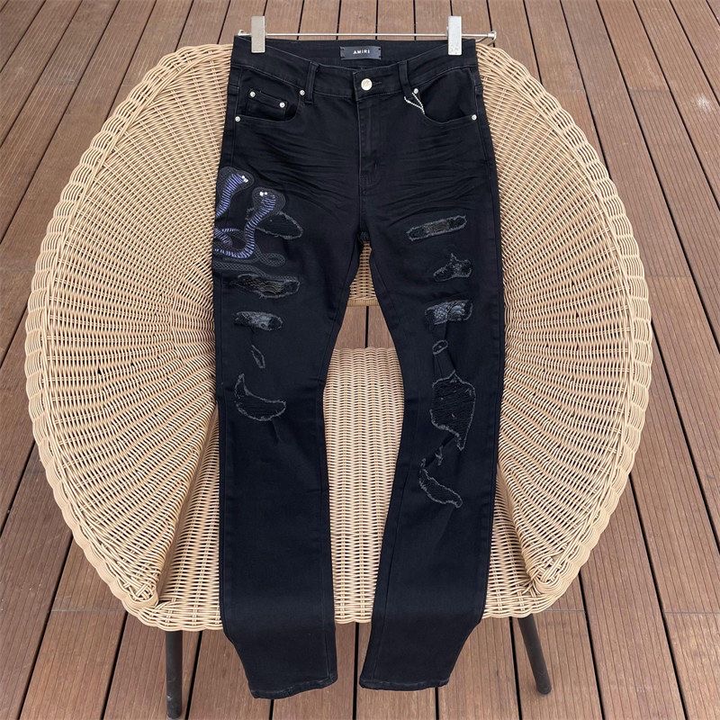 AMIRI Washed Vintage Hole Embroidered Cobra Denim Pants