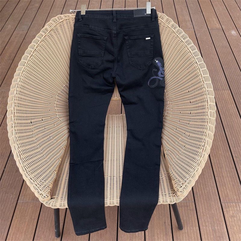 AMIRI Washed Vintage Hole Embroidered Cobra Denim Pants